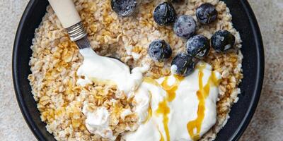 oatmeal with berries healthy breakfast oat porridge fresh cooking appetizer meal food snack on the table copy space food background rustic top view photo