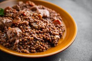 lentils with meat beef or pork fresh cooking appetizer meal food snack on the table copy space food background rustic photo