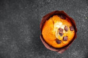 muffin chocolate sweet dessert cake appetizer meal food snack on the table copy space food background rustic top view photo