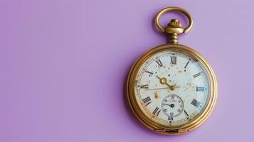 Soft lilac background featuring an old pocket watch with generous copyspace for text photo