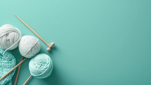 elegante par de tejido de punto agujas con hilo en un sereno suave azul fondo, ideal para copyspace foto