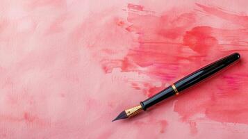 Elegant calligraphy brush on a serene dusty rose background, ideal for creative copyspace photo