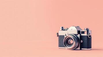 Vintage camera on a peach background with ample copyspace, capturing nostalgia photo
