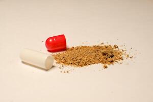 open tablet.tablet contents. white and red tablets. close-up . the concept of health, treatment. photo