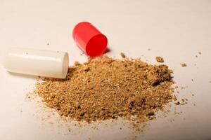 open tablet.tablet contents. white and red tablets. close-up . the concept of health, treatment. photo