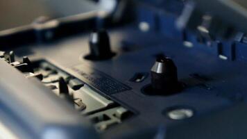 Close up of The inside of a portable walkman player. Spinning cassette tape player. video