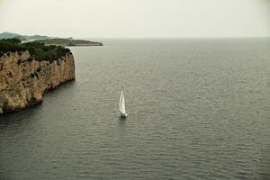September 2023, Sailing boat anchored near the coast of Dubrovnik, Croatia . Sailing yacht in the Adriatic Sea near Dubrovnik, Croatia photo
