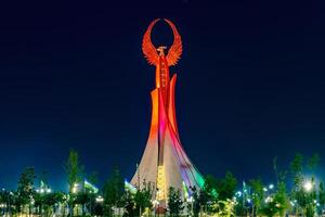 Tashkent, Uzbekistan April 27, 2023 Memorial of Freedom and Independence in the form of a pyramid with a structure of national color on the square of the city park New Uzbekistan Yangi Uzbekistan photo