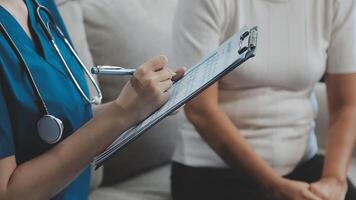 Doctor and patient discussing something while sitting at the table . Medicine and health care concept. Doctor and patient video