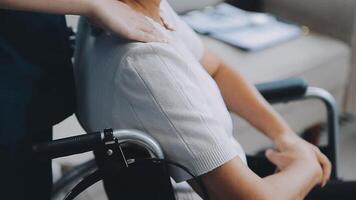 Happy senior woman doing exercise at home with physiotherapist. Old retired lady doing stretching arms at home with the help of a personal trainer during a rehabilitation session. video