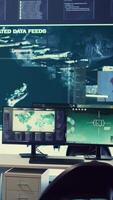 Vertical Empty military control room headquarters with a big display used to monitor global surveillance system with a world map. Army intelligence equipment and satellite radar footage, operation room. video
