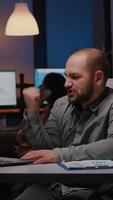 Happy successful businessman enjoying while looking at laptop computer display receiving professional company good job. Joyful happy executive manager working in office late at night video