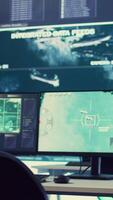 Vertical Government anti terrorism operation room equipped with a big display and surveillance on satellite radar cctv used for reconnaissance. Empty military command center with high tech. video