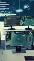 Vertical Federal agency command center equipped with surveillance and satellite system overseeing threats or danger on a world map. Military control room headquarters with a dashboard. video