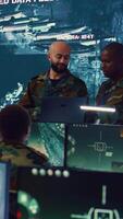 Vertical Army officers providing details for a new national safety mission, diverse team briefing their soldiers in a military base of operations. Specialists working with reconnaissance big data. Camera B. video