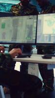 Vertical Officers team managing air traffic control for military aircrafts within the operational area, using CCTV radar surveillance. Evaluating and presenting mission plans to their crew. Camera B. video