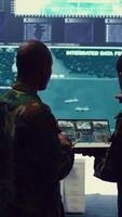 Vertical Intelligence analysts supervising and coordinating the big data analysis, processing tactical information to help the field troops. Officers monitoring real time warfare information. Camera B. video