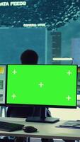Vertical Private monitors national guard activity with military CCTV satellite system, working with a greenscreen display on pc in command center. IT reconnaissance operator tracking ships. Camera B. video
