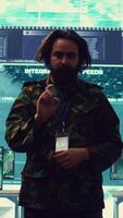Vertical Command sergeant major employs high tech holograms to examine real time data for a mission, working on ways to protect the national coast line. Creating an attack plan. Camera B. video