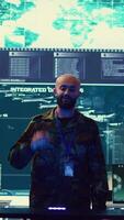 Vertical Navy operation specialists monitoring surveillance radar through a hologram, working with 3d illustrations in a military control center. Team of generals gathering intelligence. Camera B. video