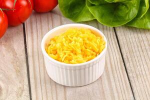 Shredded cheese in the bowl photo