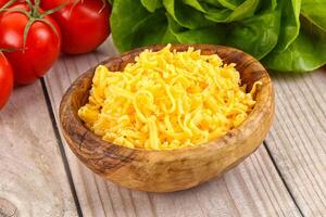 Shredded cheese in the bowl photo