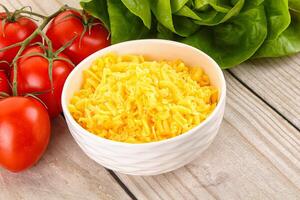 Shredded cheese in the bowl photo