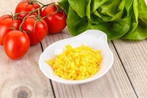 Shredded cheese in the bowl photo