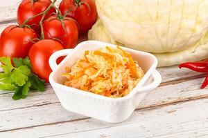Fermented cabbage sauerkraut in the bowl photo