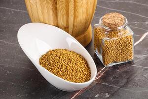 Mustard dry seeds in the bowl photo