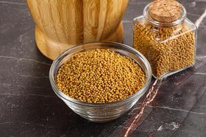 Mustard dry seeds in the bowl photo