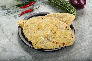 Indian tandori bread - naan with cheese photo