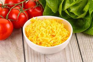 Shredded cheese in the bowl photo