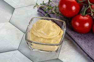 Dijon mustard sauce in the bowl photo