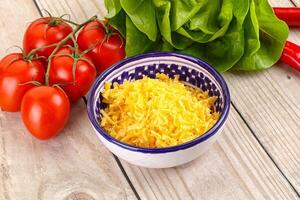 Shredded cheese in the bowl photo