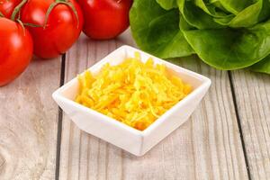 Shredded cheese in the bowl photo