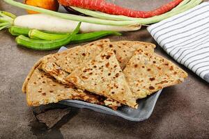 Indian Aloo Paratha - bread with potato photo
