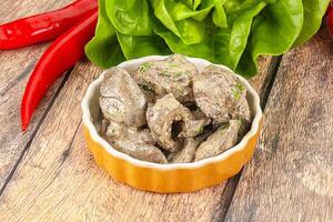 Chicken liver with cream sauce photo