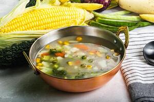 Soup with corn and broccoli photo