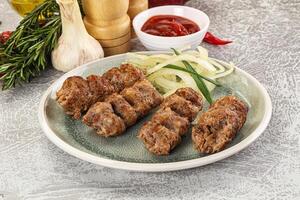 Beef kebab minced meat with onion photo