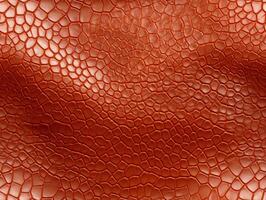 Close-up snake leather with a smooth, slightly uneven texture. photo