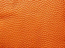 Close-up leather with a smooth, slightly uneven texture. photo
