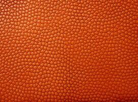 Close-up leather with a smooth, slightly uneven texture. photo