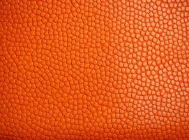 Close-up leather with a smooth, slightly uneven texture. photo