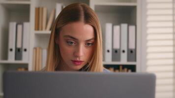 Woman girl business accountant businesswoman using laptop at home office confused dissatisfied with documents mistake check data in papers and computer doing accounting work financial problem annoyed photo