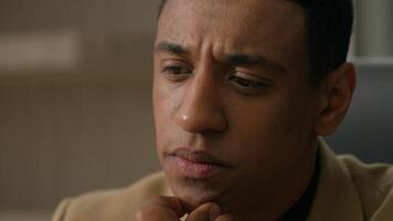 Close up portrait thoughtful doubtful African American man pensive male businessman business entrepreneur think deep in thoughts difficult question pondering search problem solution thinking decision photo