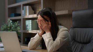 Caucasian businesswoman in office computer error crash business woman girl female worker sit at desk work on laptop upset problem device system bug data loss battery low issue unsaved lost information photo