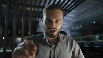 Business contract problem report mistake Caucasian angry aggressive yelling scolding businessman at dark evening office annoyed employee man talking shouting at camera call with papers documents photo