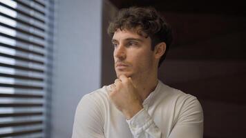 Pensive worried deep in thoughts Caucasian leader specialist professional thinking idea ponder problem solution solving question businessman office employer business difficulty man looking at window photo