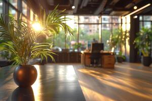 A large, empty office room with a sun shining through the windows. Modern space is made of glass and has a shiny, reflective surface photo